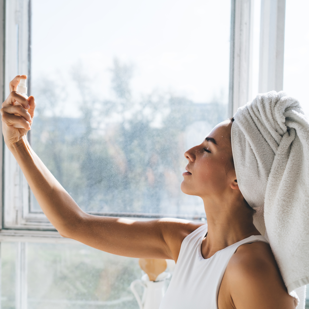 Woman using skincare mist
