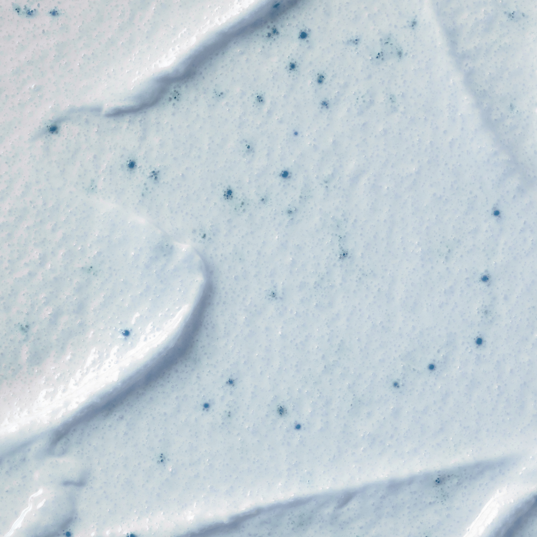Skincare product with blue dots