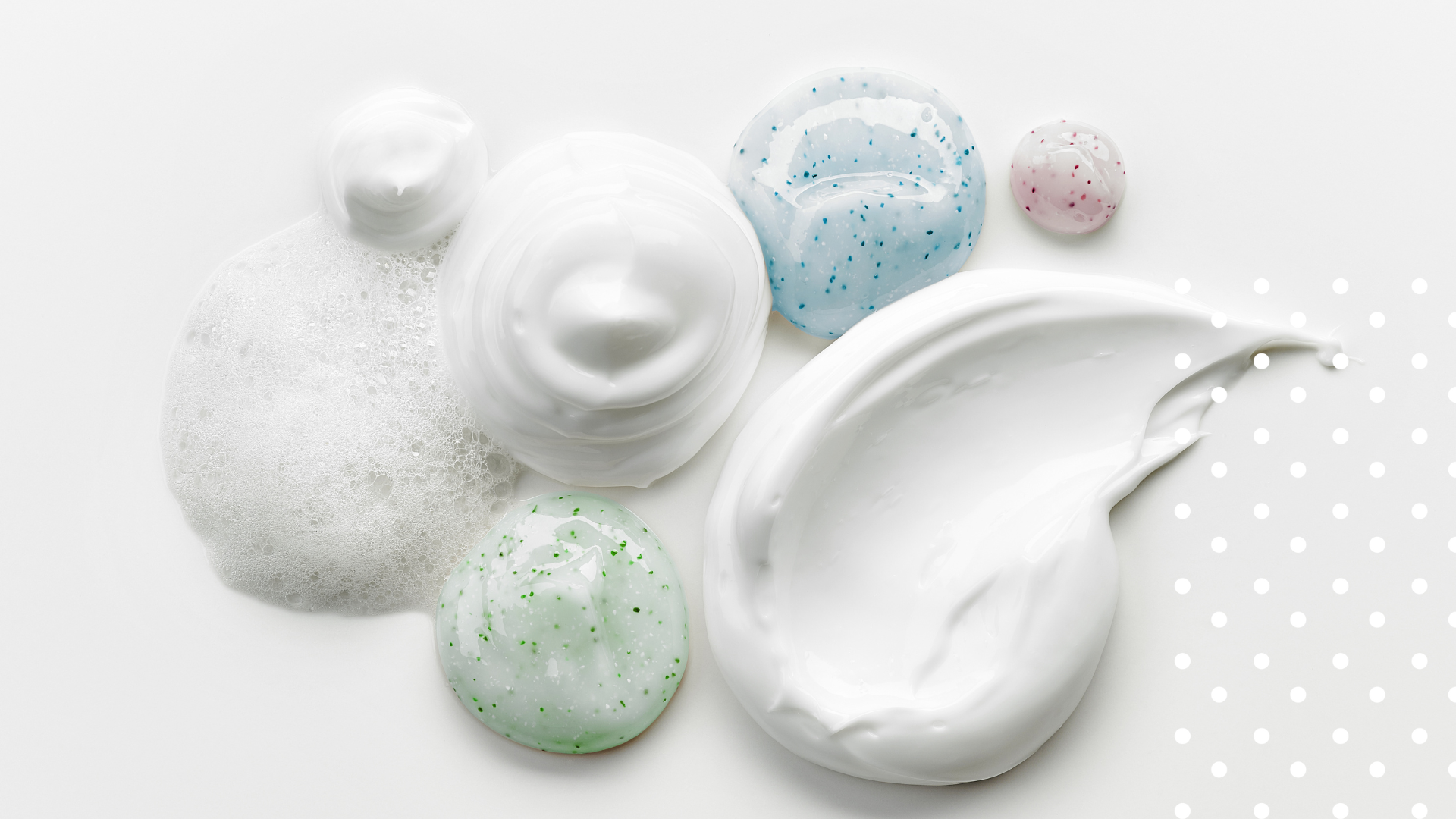 White cream with colorful speckles on a white background